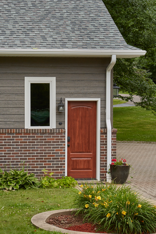 wm_timbergrain_cherry_2panelarch_beauty1-1 New construction garage service door
